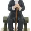 סבא מפוליריזן יושב על ספסל ומחזיק מקל הליכה - לסבא באהבה 11 ס"מ